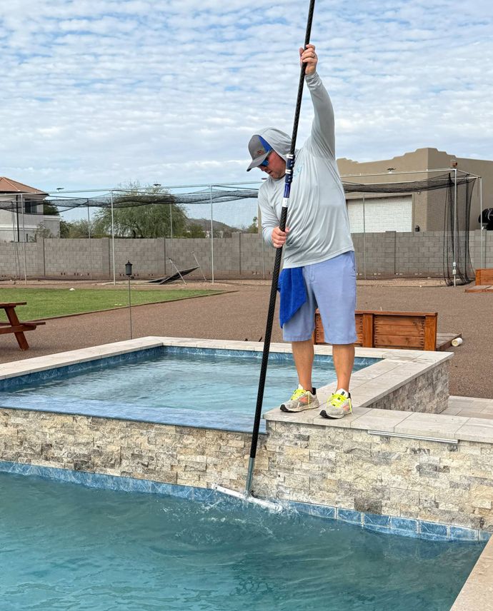 pool maintenance brushing and skimming
