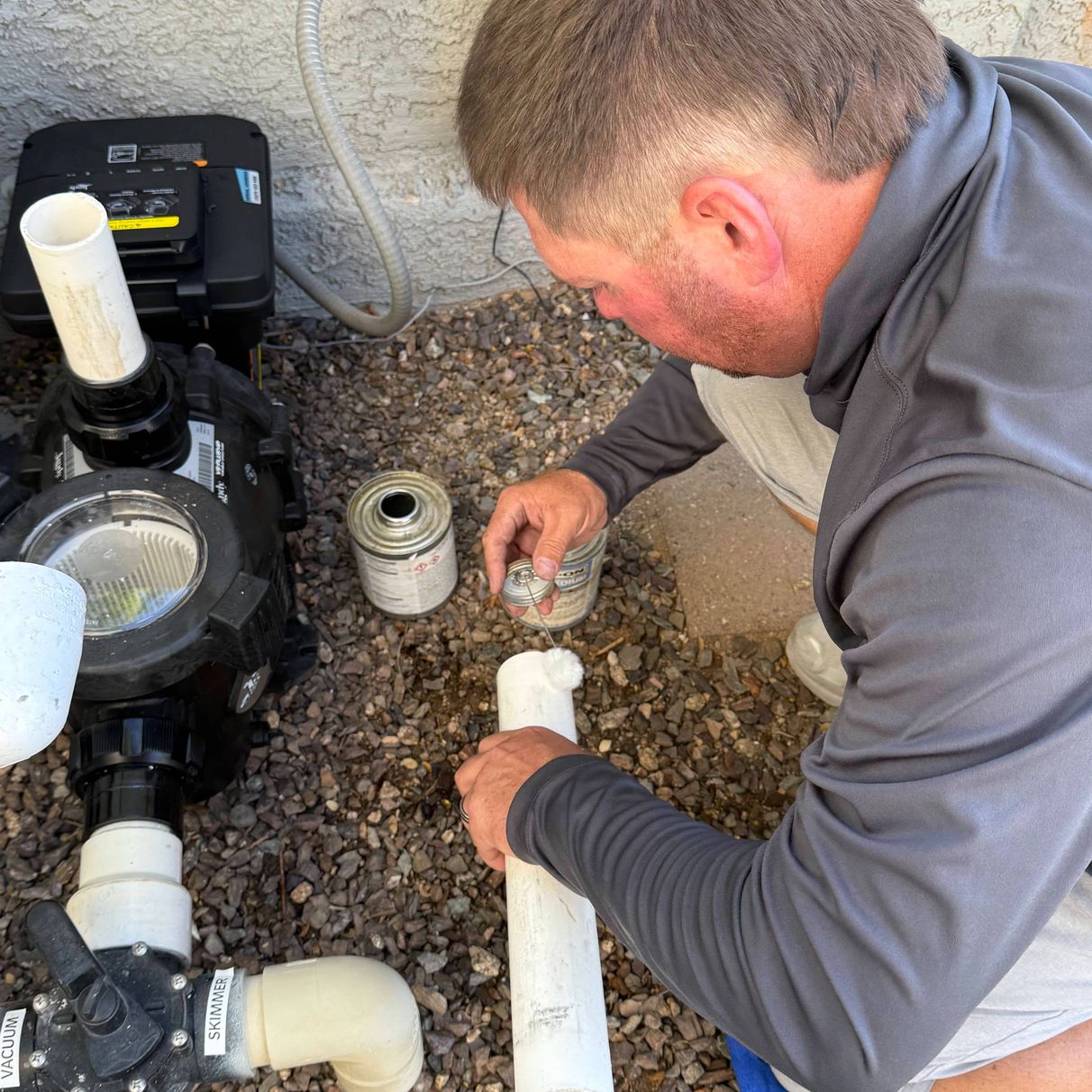 pool technician working on pump repair